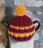 Small Tea Cosy for 2 Cup Tea Pot, Dark Red & Gold Striped, Hand Knitted - Image 1