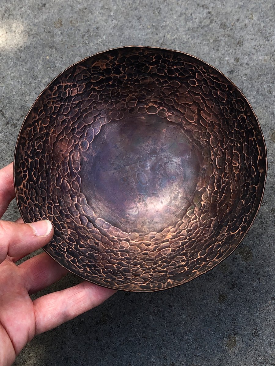 Hand raised copper bowl with hammered and oxidised finish.