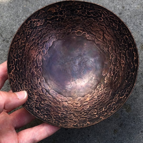 Hand raised copper bowl with hammered and oxidised finish.