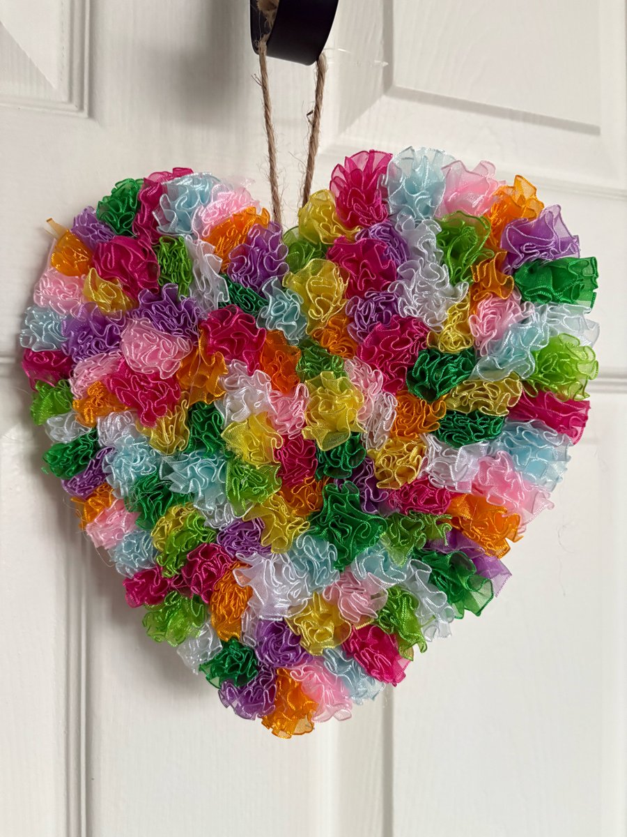 Wood chiffon Pom Pom decorated heart. 