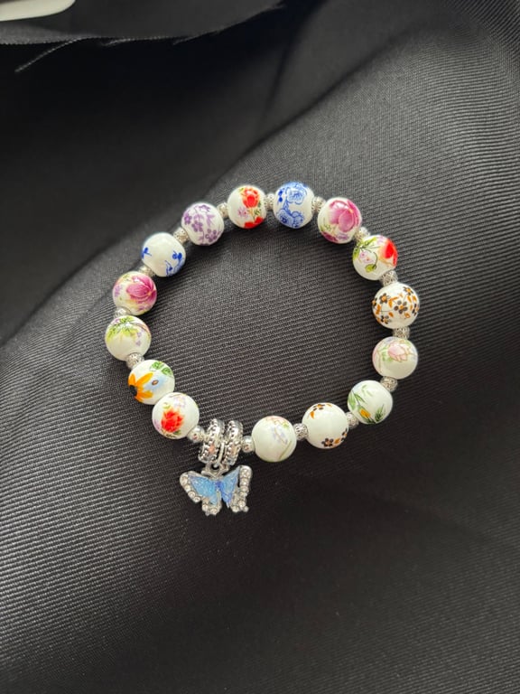 Handmade bracelet, beads & butterfly charm. 16cm. Would make lovely gift. 