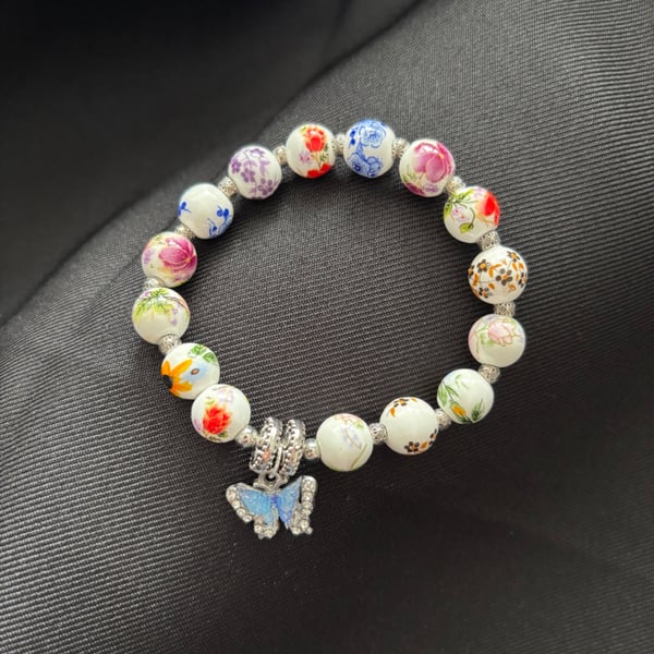 Handmade bracelet, beads & butterfly charm. 16cm. Would make lovely gift. 