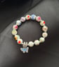 Handmade bracelet, beads & butterfly charm. 16cm. Would make lovely gift. 