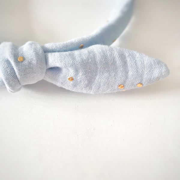 Alice Band in Baby Blue Double Gauze Fabric with Gold Dots and Bow Embellishment