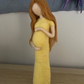 Felted lady cradling her baby bump