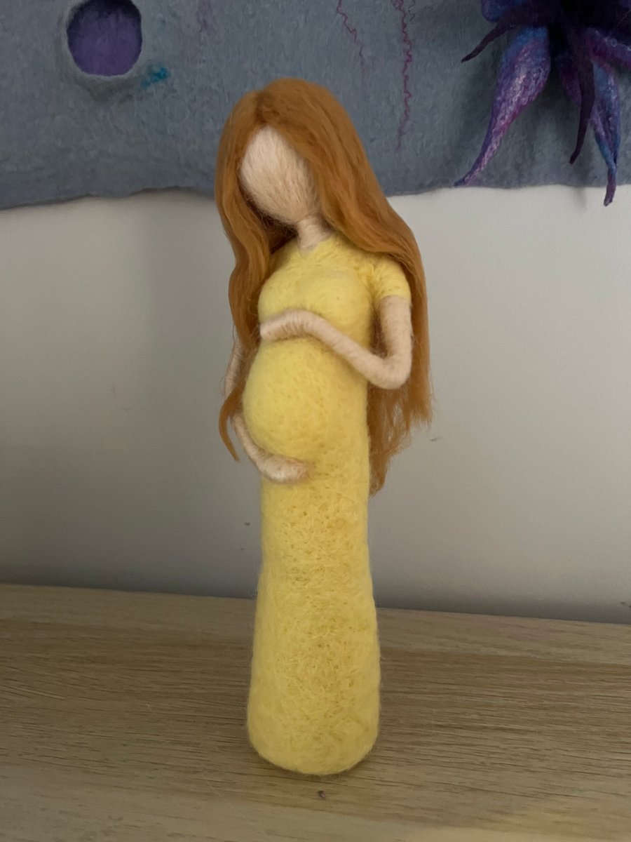 Felted lady cradling her baby bump