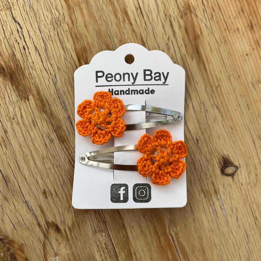 Girl’s hair clips, pair of flower clips in bright orange