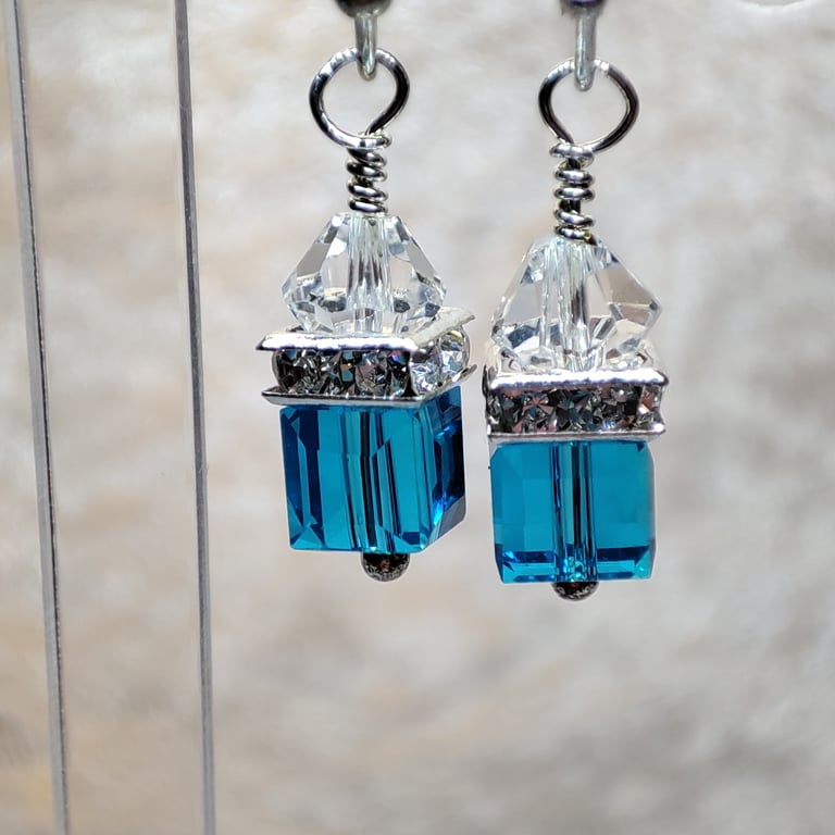 Crystal earrings with silver plated wires, turquoise and clear