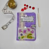 Sewing needle case in mauve fabric with vintage embroidery 