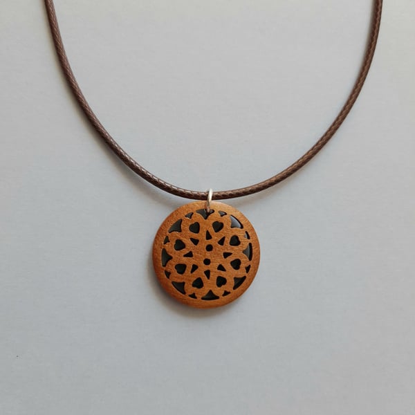 Wooden Rosette Pendant Necklace: Brown Waxed Cord, Adjustable Length.