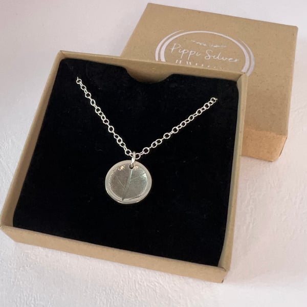 Concave circular leaf imprint pendant necklace