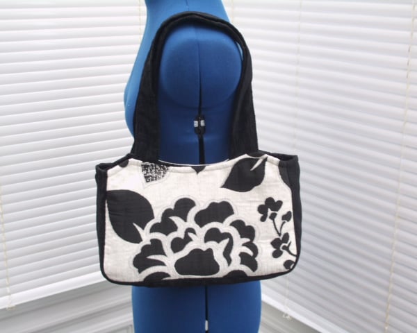Handbag with black and with flowers