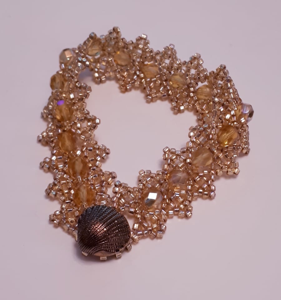 Pretty golden  beaded bracelet with crystals