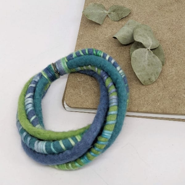 Felted cord bracelet in spring greens and jade blues