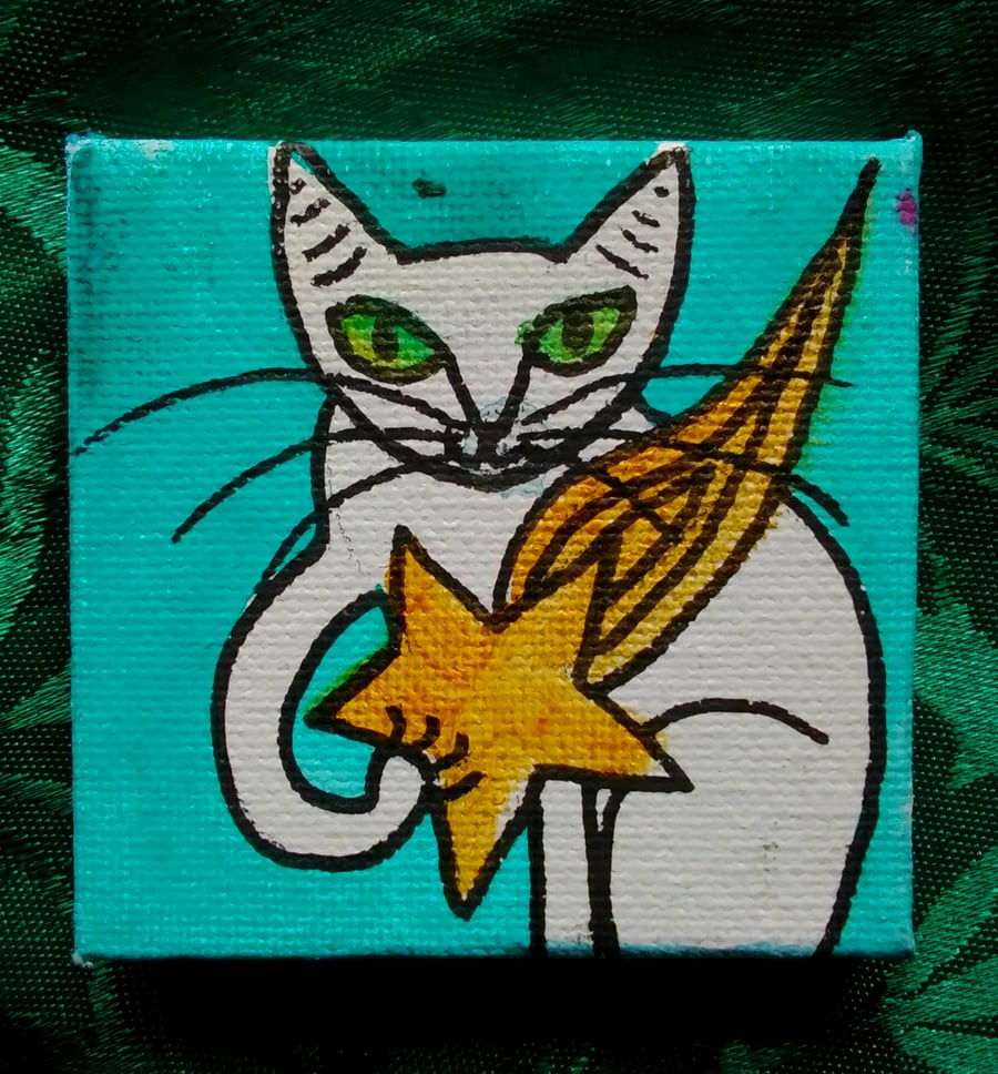 White cat with star painting 