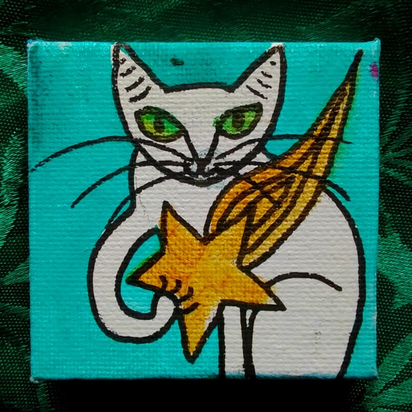 White cat with star painting 