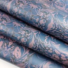 Rococo swirls design wrapping paper in blue and orange