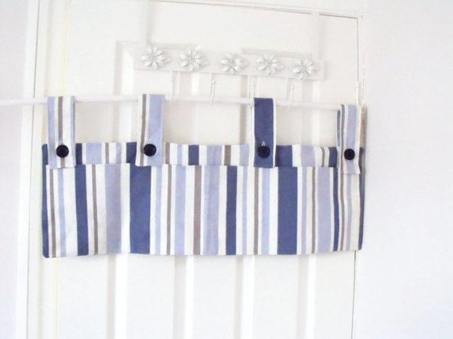 hanging bunk bed tidy with pockets to store books, controllers, toys etc. Blue