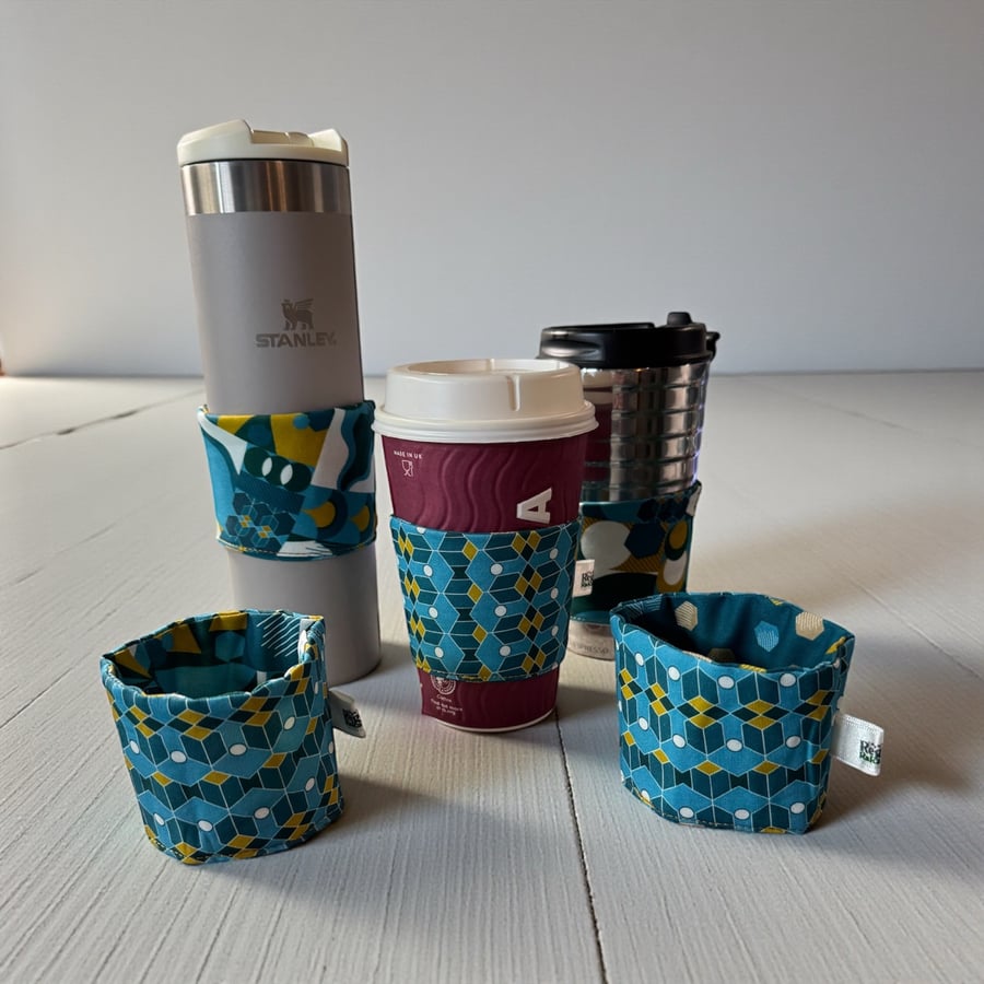 Reversible Cup Sleeve for Disposable and Travel Cups.