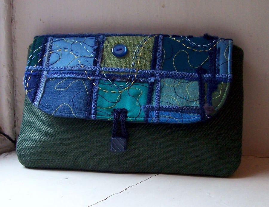 Textile art clutch bag with hand and machine embroidery