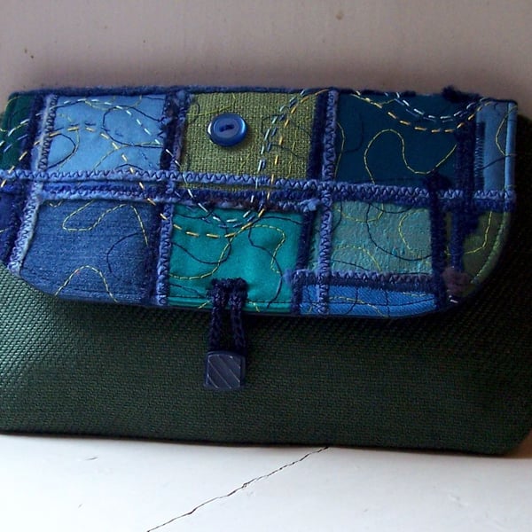 Textile art clutch bag with hand and machine embroidery