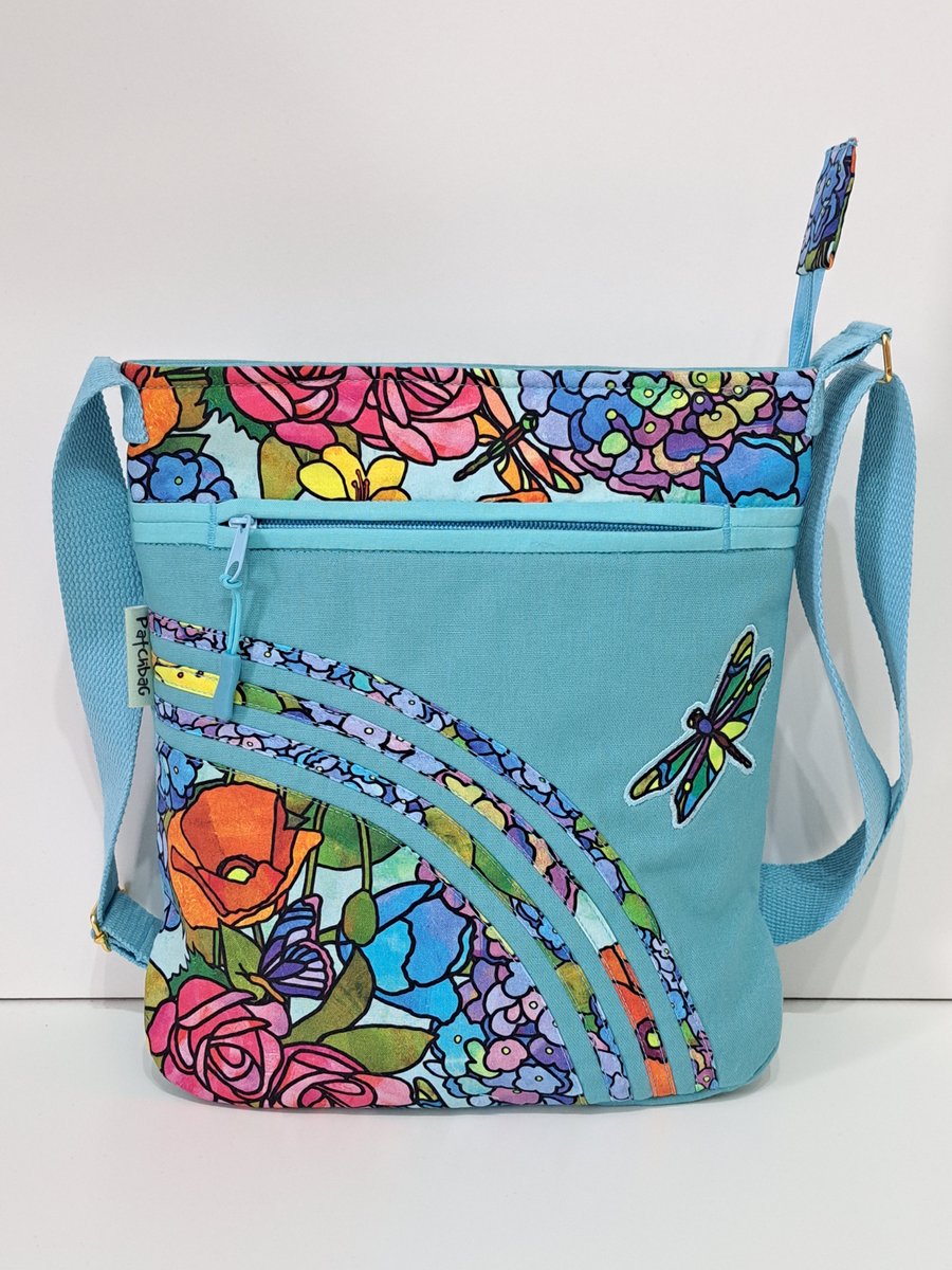 Turquoise shoulder bag with stained glass flowers 