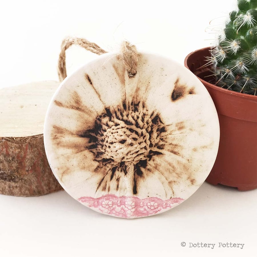 Pottery decoration with natural flower design.