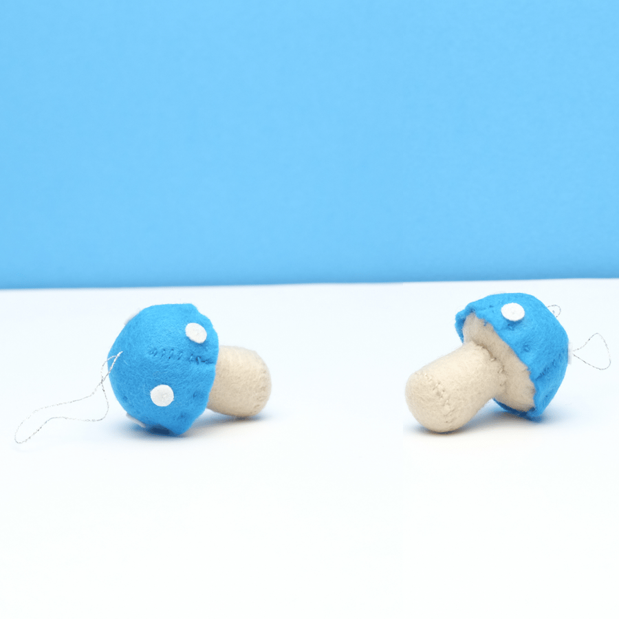 A pair of blue toadstools with glitter detail