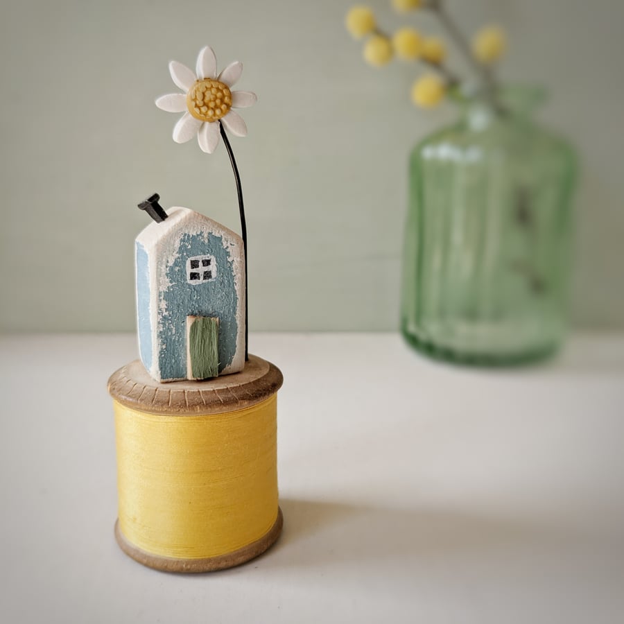 Wooden House on a Vintage Thread Bobbin with Clay Daisy 
