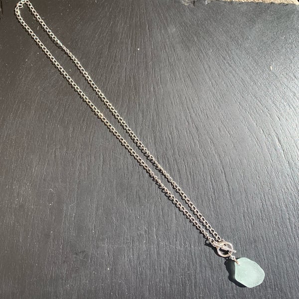 Blue-green seaglass drop on silver plated mount & toggle fastening chain