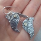 Beautiful sterling silver dangle earrings in a crushed leaf shape and style