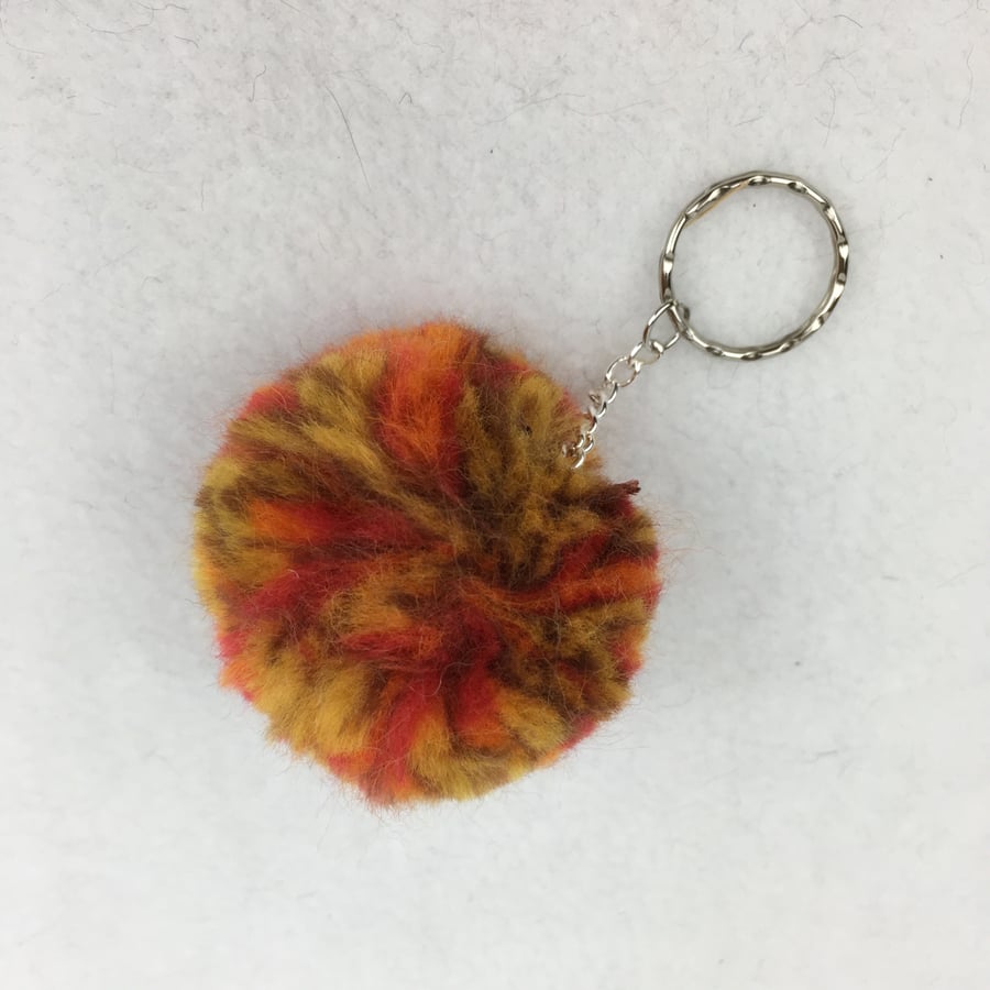 Soft, fluffy, merino wool pom pom key ring in orange