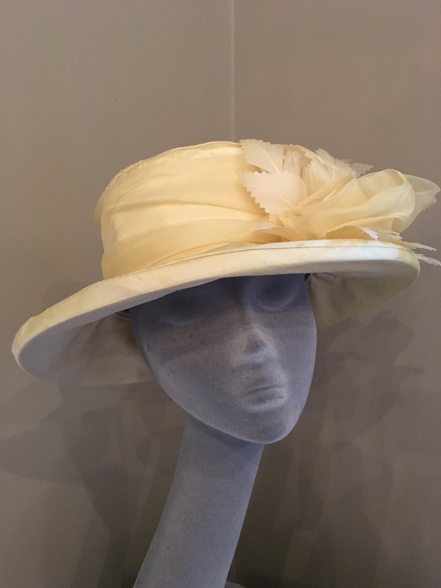 Handmade silk hat in soft lemon dupion trimmed with silk roses and feathers
