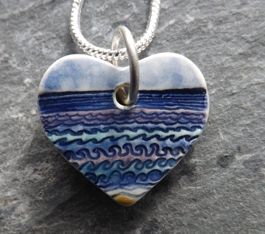 Ceramic heart shaped Waves pendant in blue, purple and turquoise 