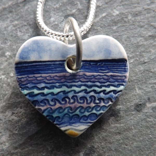 Ceramic heart shaped Waves pendant in blue, purple and turquoise 