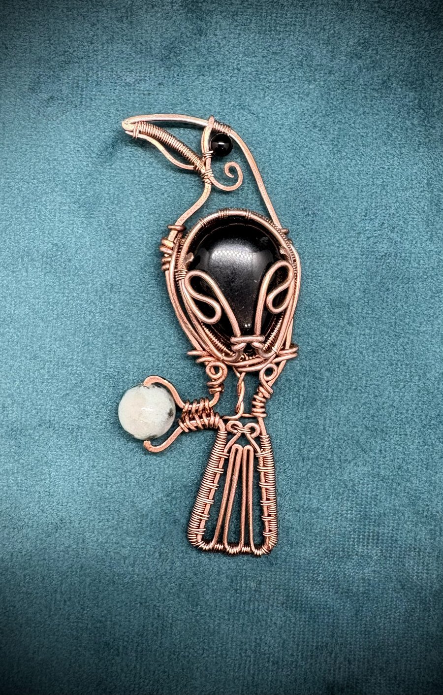 Antique copper wire wrapped Raven clutching an egg