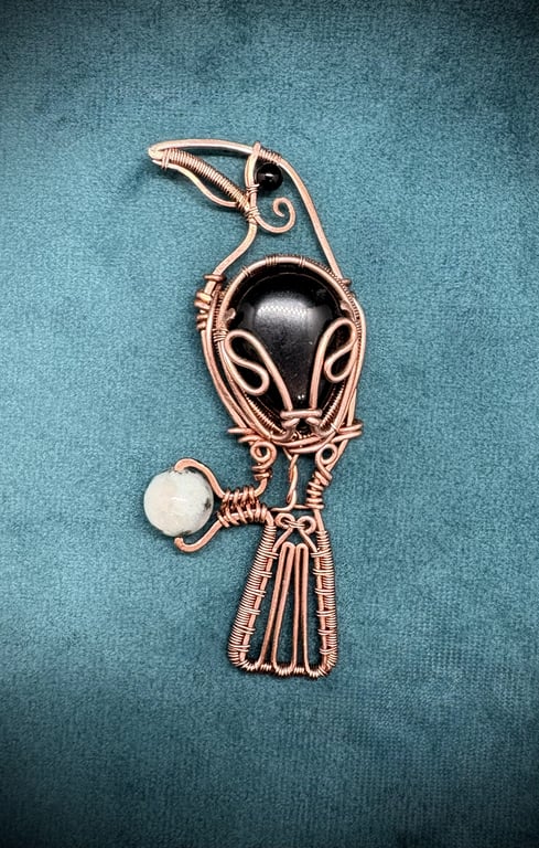 Antique copper wire wrapped Raven clutching an egg