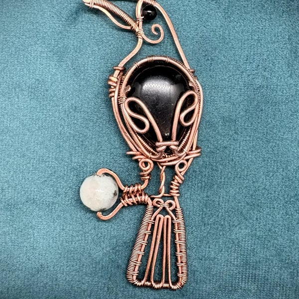 Antique copper wire wrapped Raven clutching an egg