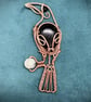 Antique copper wire wrapped Raven clutching an egg