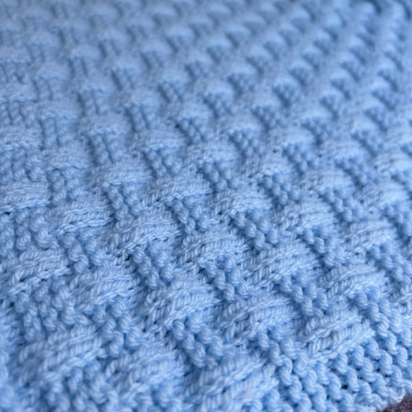 Small Baby Blanket in a powder blue basket weave pattern 