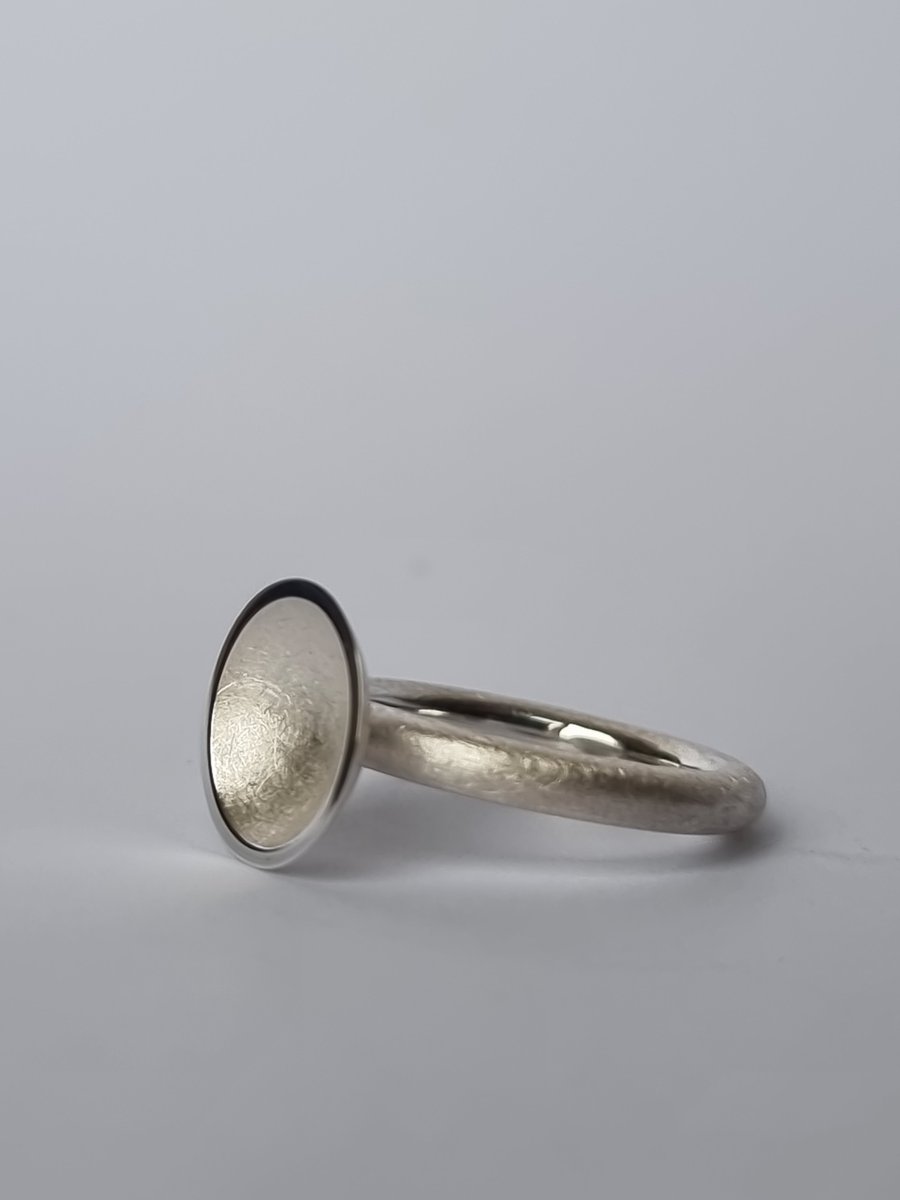 Sterling silver textured concave dome ring.