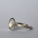 Sterling silver textured concave dome ring.