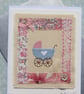 Little pram embroidered card to welcome a new baby, silk bow and mop button