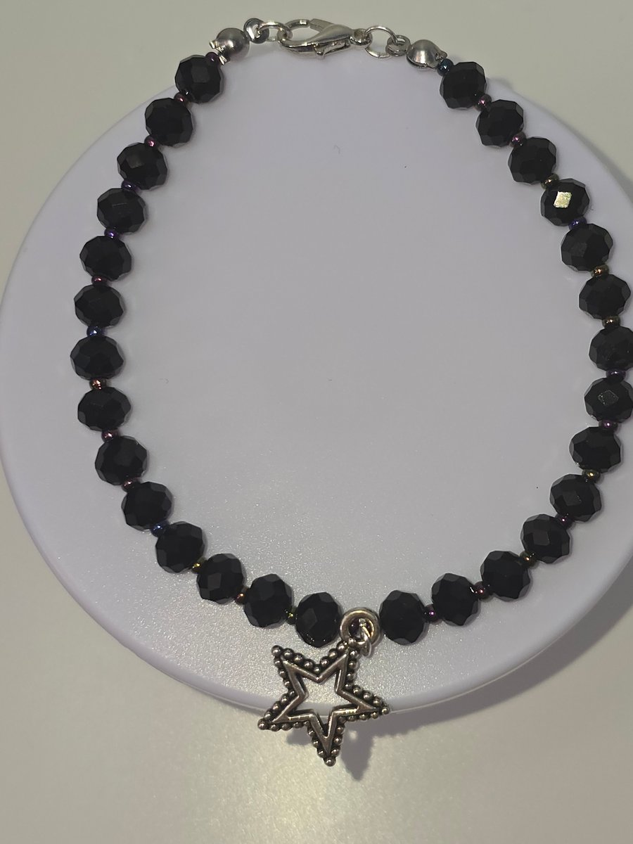 Black beaded star charm bracelet