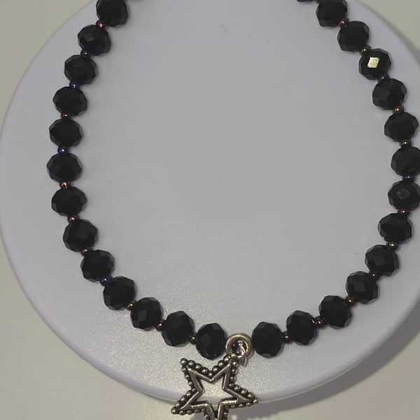 Black beaded star charm bracelet