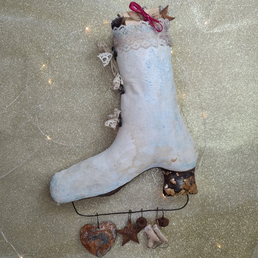 Textile art vintage style hanging ice skate with litle gifts.