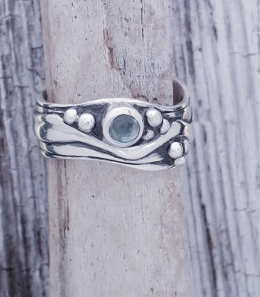 Medium Wave Ring with Topaz Size L-S