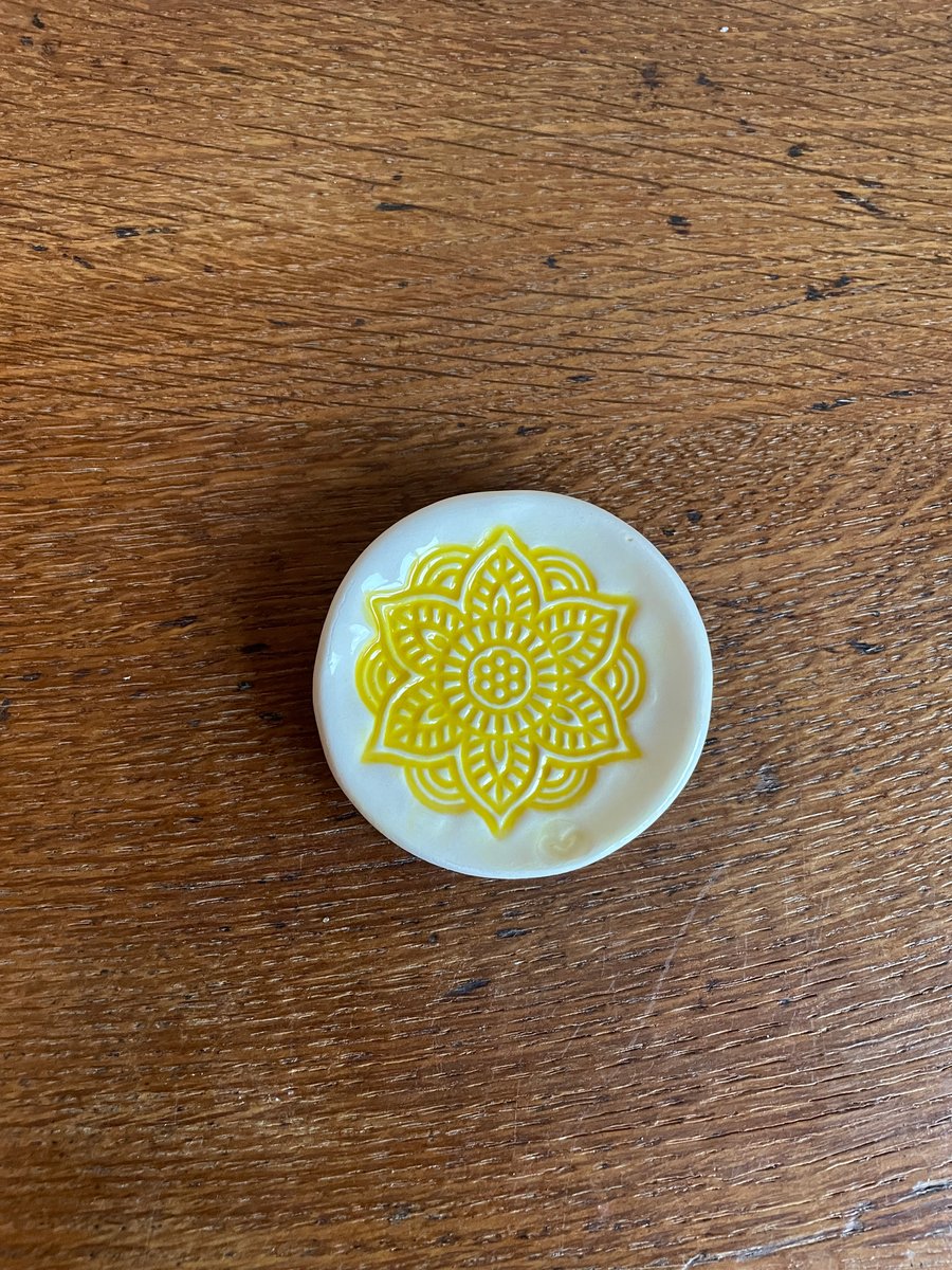 Ring dish with yellow embossed Mandala design