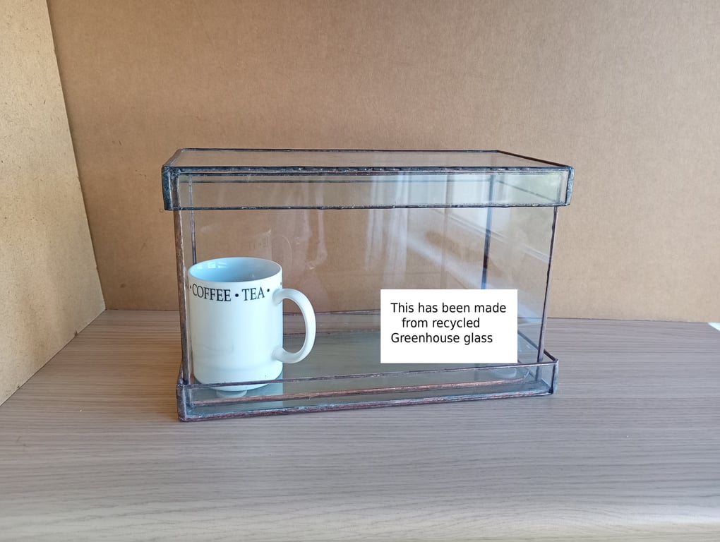 Indoor windowsill planter with corner holes for drainage, plus tray to rest on.