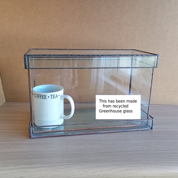 Indoor windowsill planter with corner holes for drainage, plus tray to rest on.